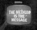 Black and white photo of an old fashioned black and white TV set with text  "The Medium is the Message" onscreen..